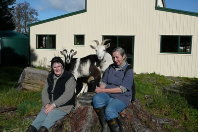 Val And Glennis enjoying the sun outside the new community room with Anthony and Agnes.