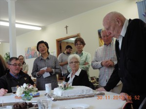 Brendan Gilmour cutting the Anniversary cake.