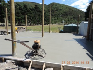 The concrete floor being poured.