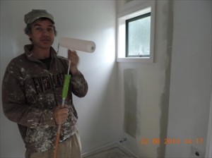 Craig painting the inside of the community room.