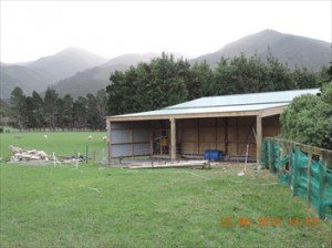 The new garage incorporates an animal pen and woodbox